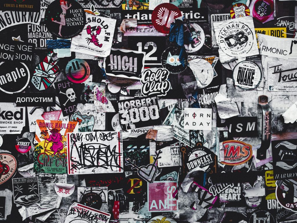 Collection of stickers, illustrating research that found stickers on road signs can trick the self-driving AI systems in autonomous cars, leading to unpredictable and dangerous behaviour.