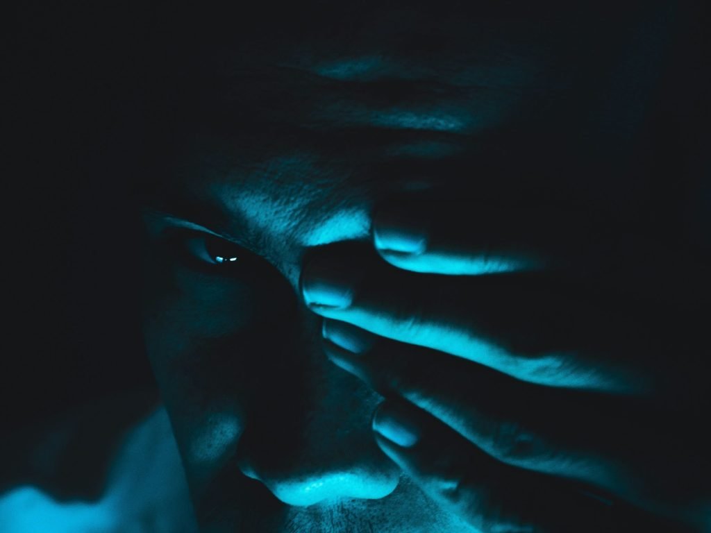Person covering an eye as many businesses are discovering that the real cost of bringing an IoT project to life goes far beyond that initial quote for connectivity.